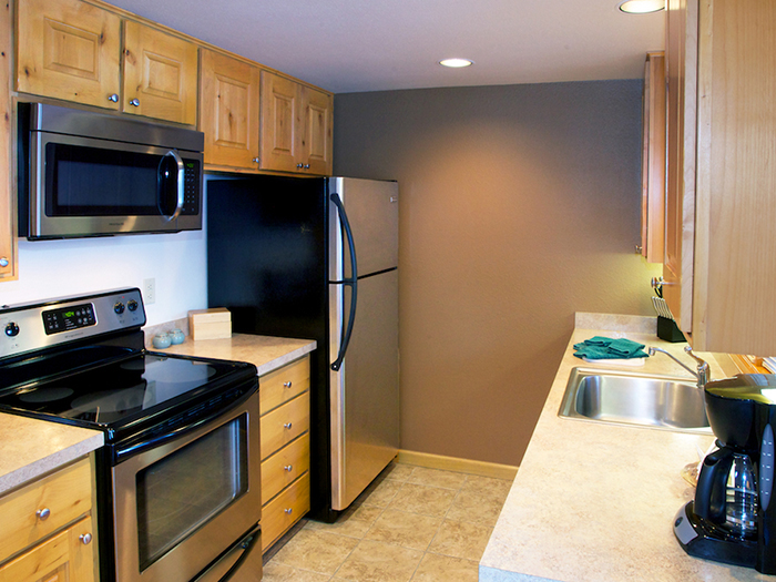 our cabins feature full kitchens. all cabins are two-bedroom, two-bath. photo 7