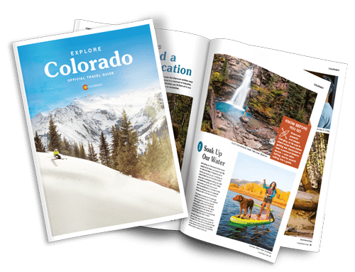 The cover of a Colorado vacation guide with a snowy scene