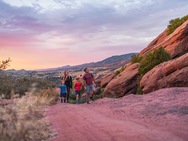 Family hiking at dusk in Colorado's beautiful high desert
