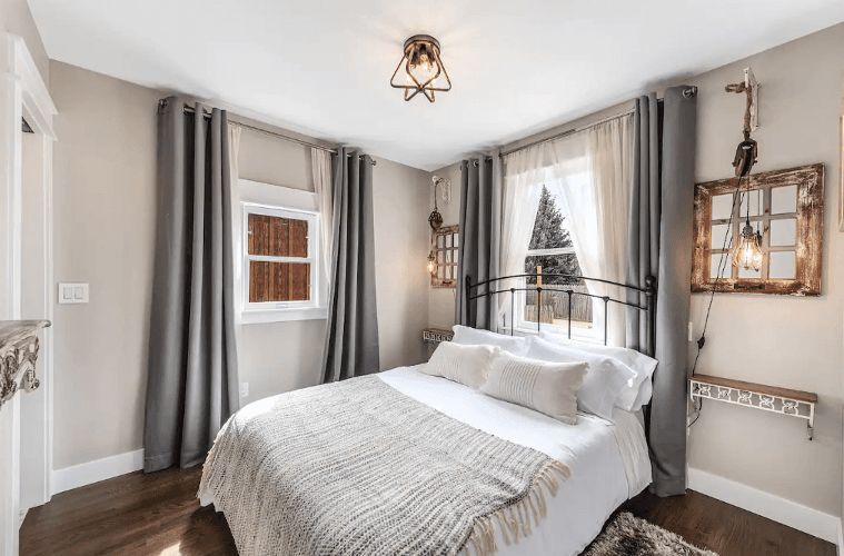 Aggie House in Louisville features cozy bedrooms in shades of white and gray