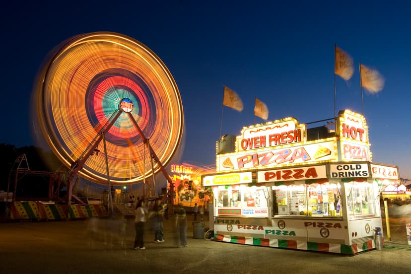 A Ferris wheel lights up the night at the Colorado State Fair - Pueblo, CO