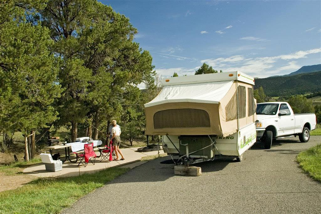 A pop-out camper all popped out at a state park