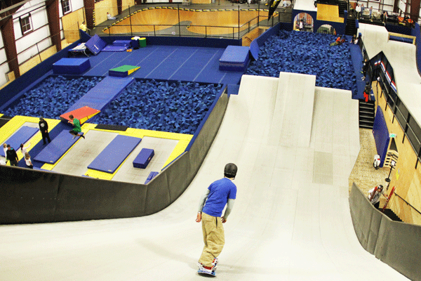 A snowboarder training on an indoor slope at The Woodward Copper Barn in Copper Mountain, Colorado.