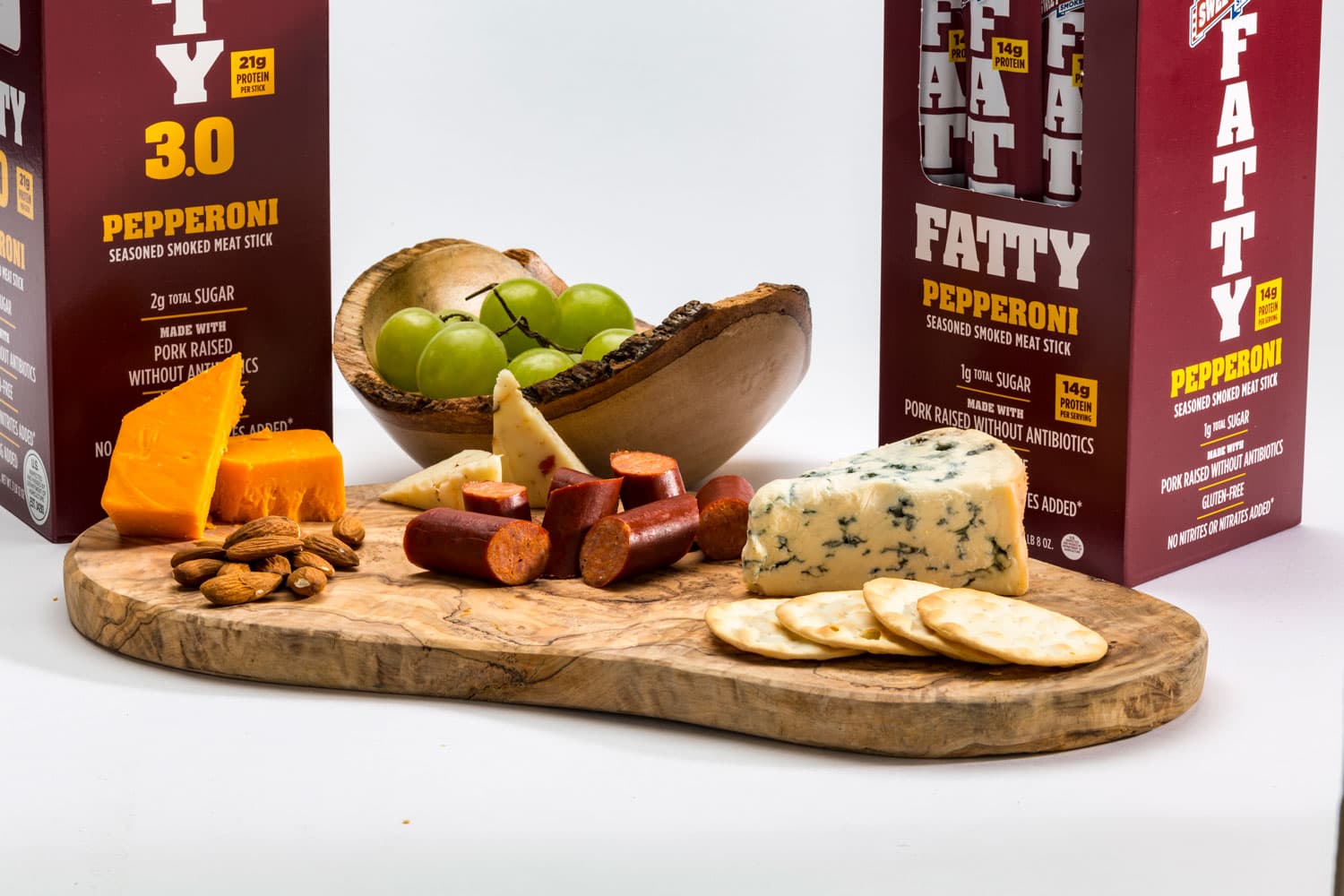 A wooded platter displays almonds, water crackers, pepperoni chunks and a variety of cheeses from Sweetwood Smokehouse Jerky in Steamboat Springs.