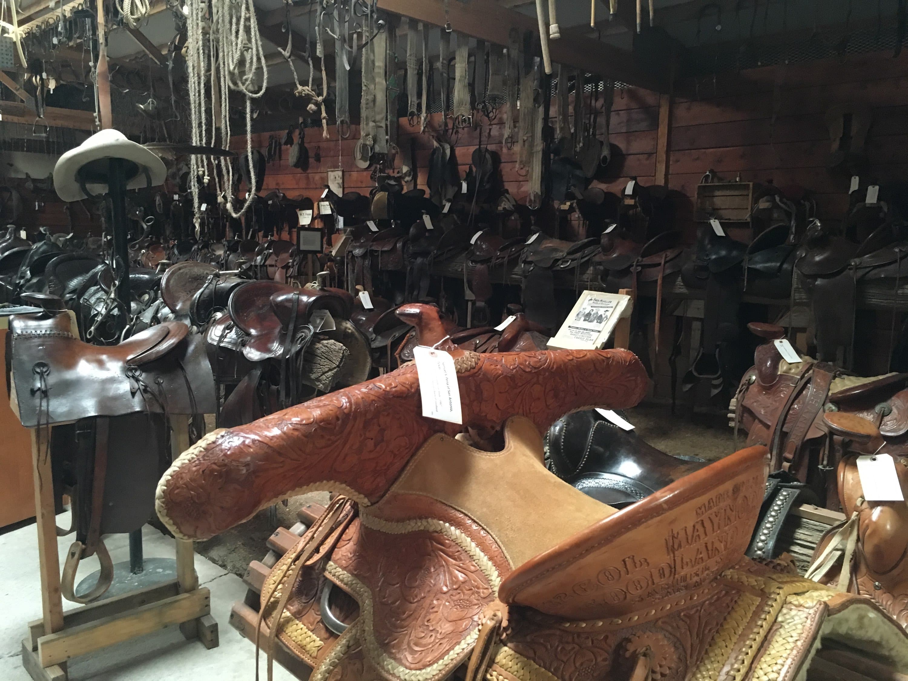 over 400 saddles and old west items also! photo