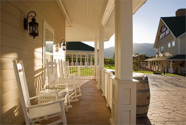 rock your cares away on our comfortable wraparound porches. photo 2