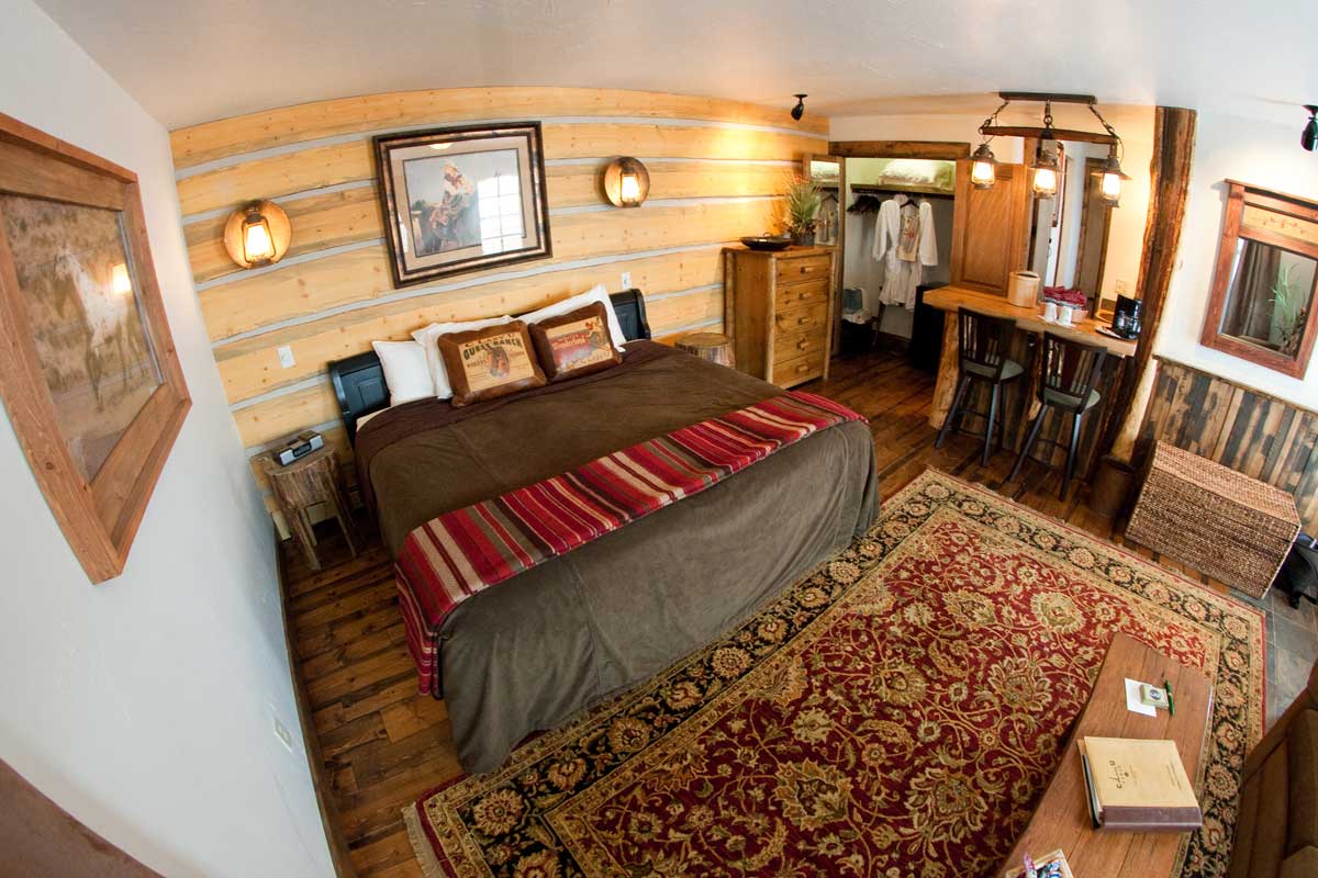 C Lazy U Ranch guest room featuring cozy furnishings and a big king bed