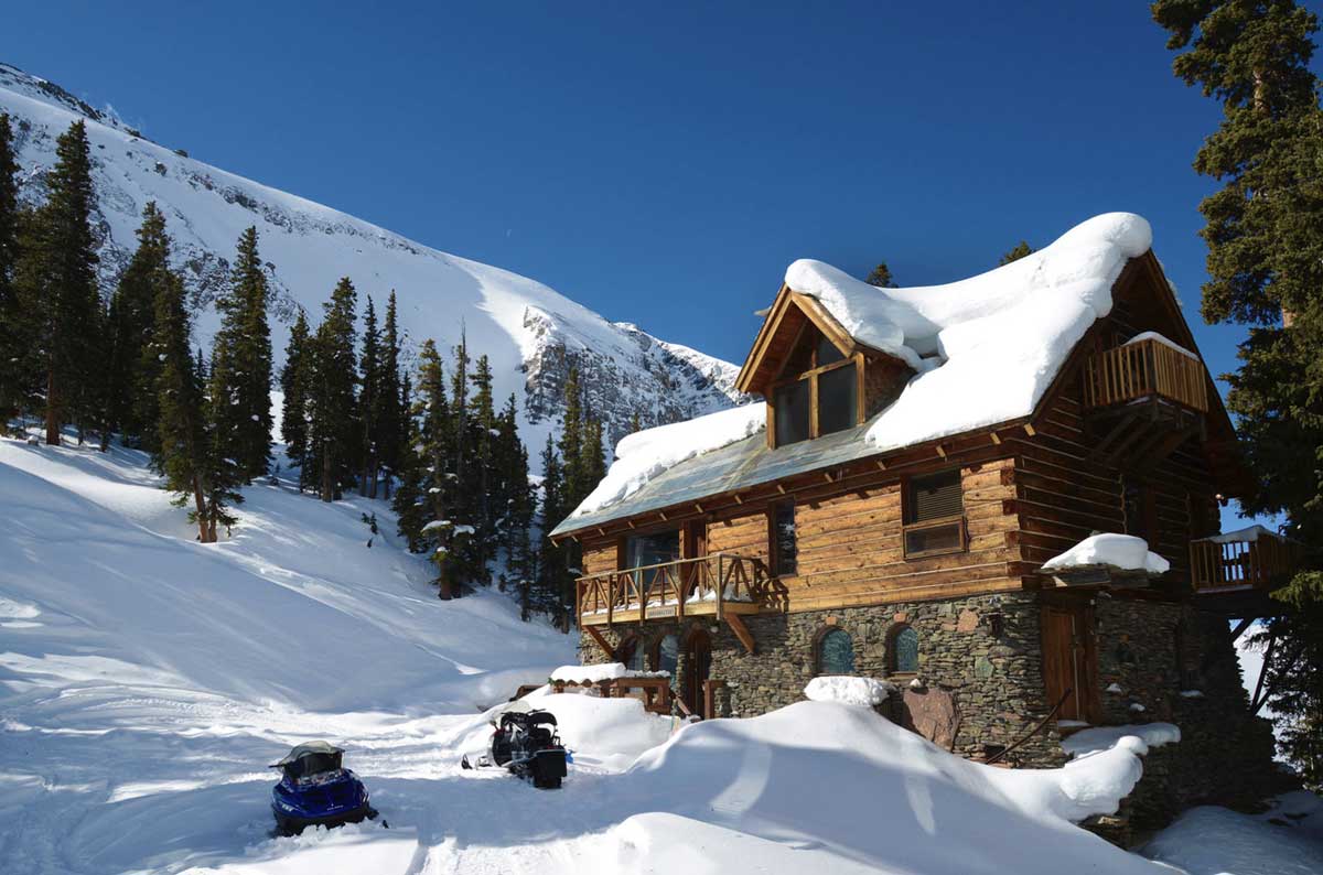 The Observatory at Alta Lakes blanketed in snow with a bright bluebird sky overhead
