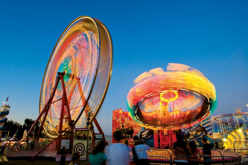 ferris wheels and rides at the colorado state fair in Pueblo, CO