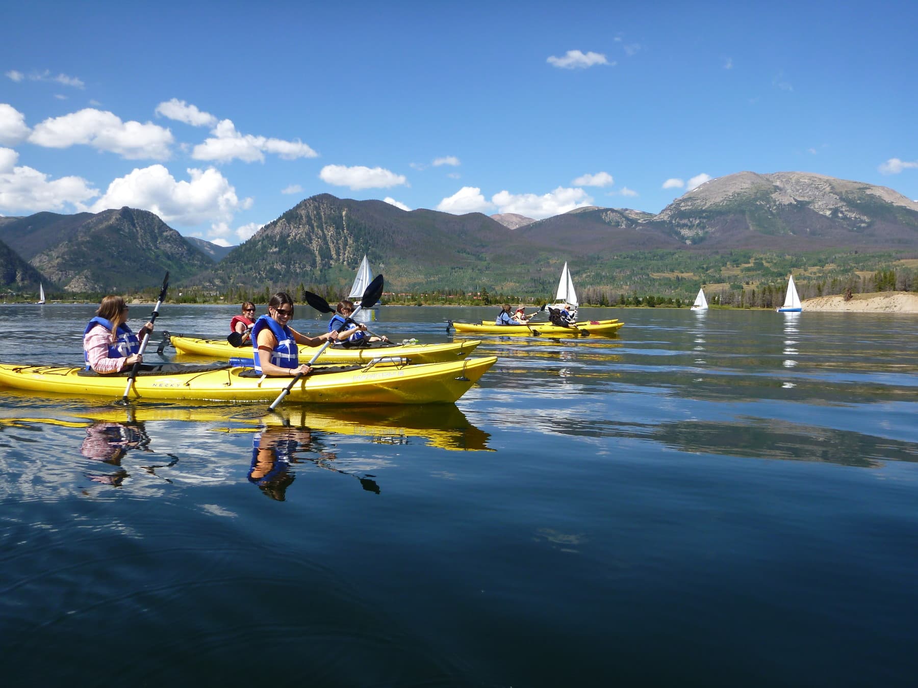 kayaking frisco bay with sailboats in the background photo