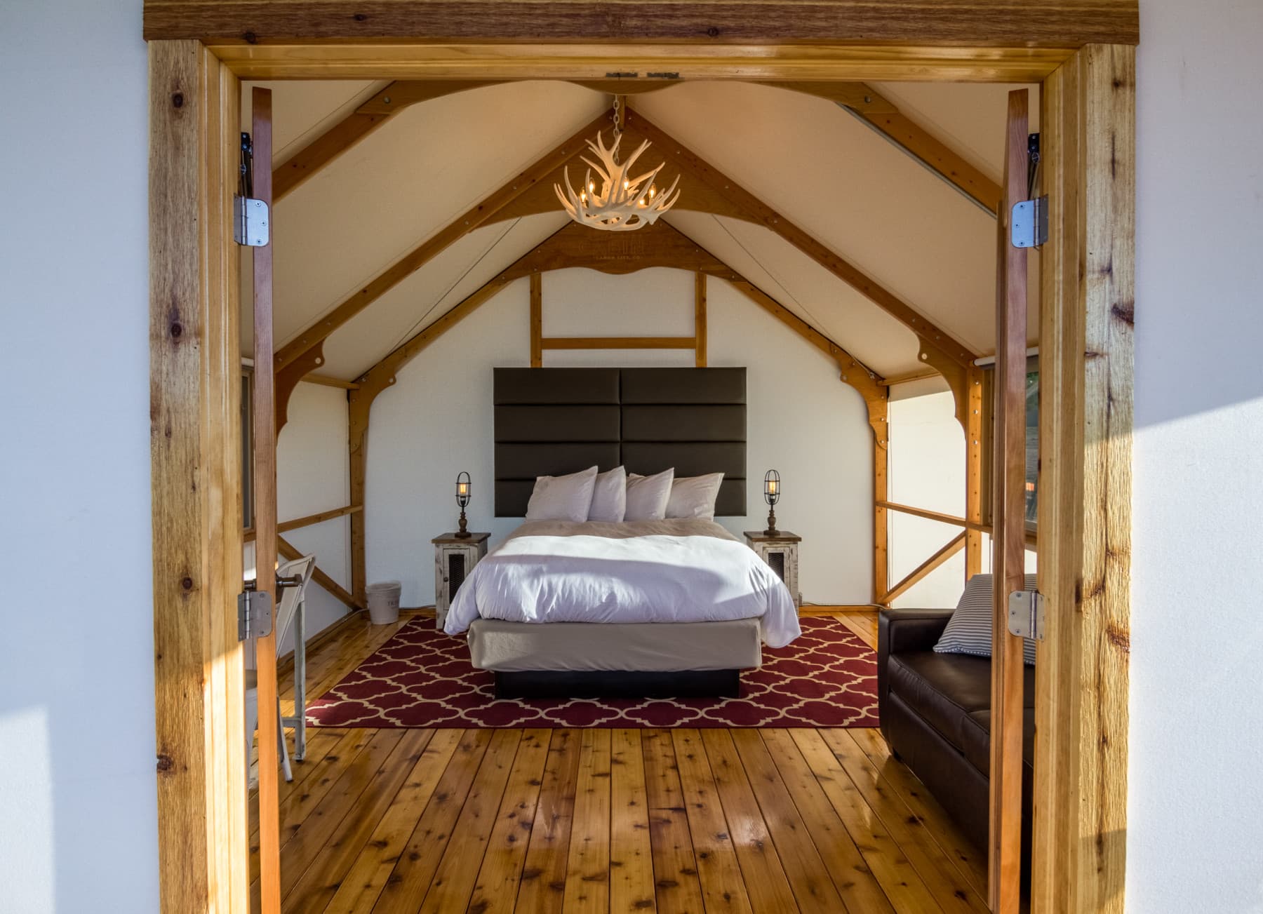 luxurious glamping tent with faux antler chandelier photo 9