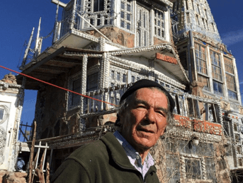 a man in front of a castle in construction
