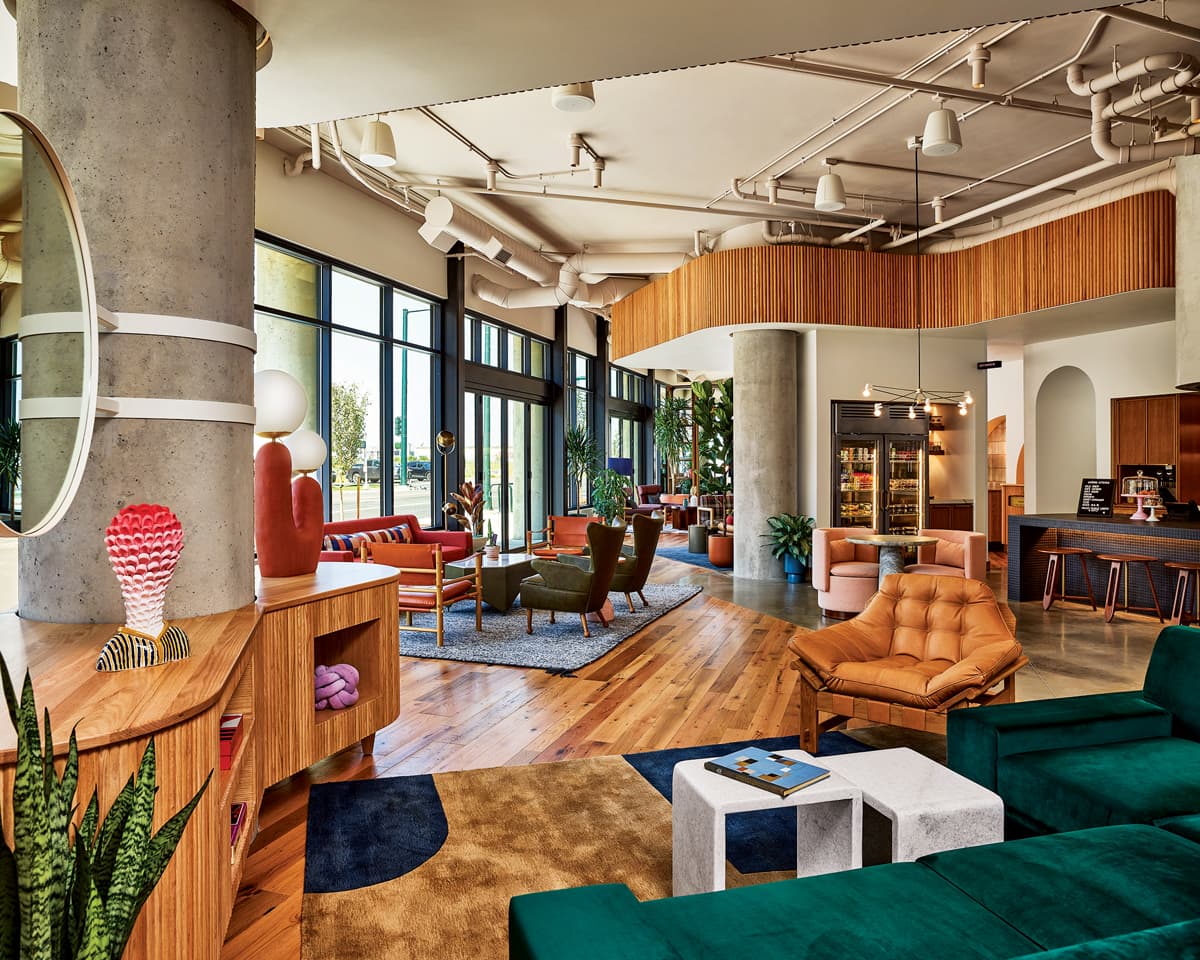 Wood and colorful furnishings in the lobby of the Catbird Hotel in Denver