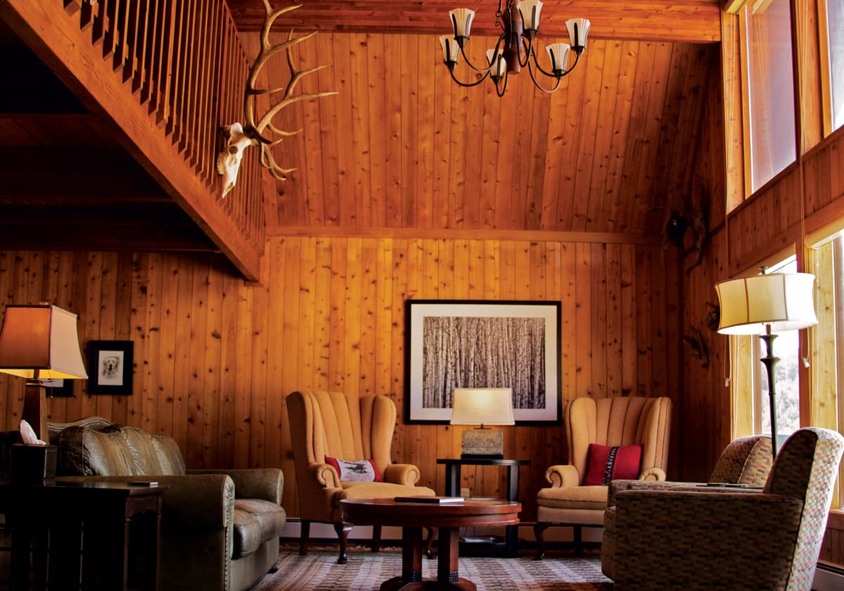 Wood-paneled lounge area at The High Lonesome Ranch in DeBeque