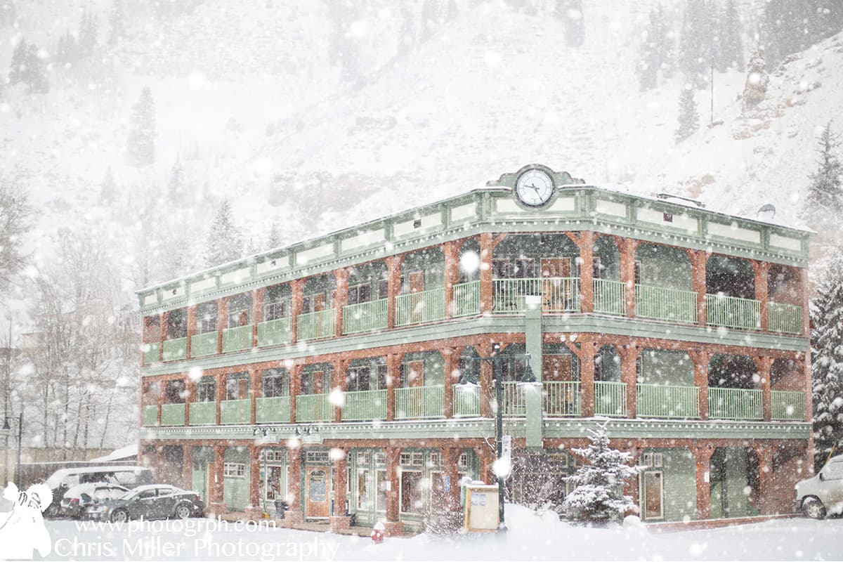 It's winter in Red Cliff and the Green Bridge Inn and the surrounding mountains are blanketed in a layer of snow.