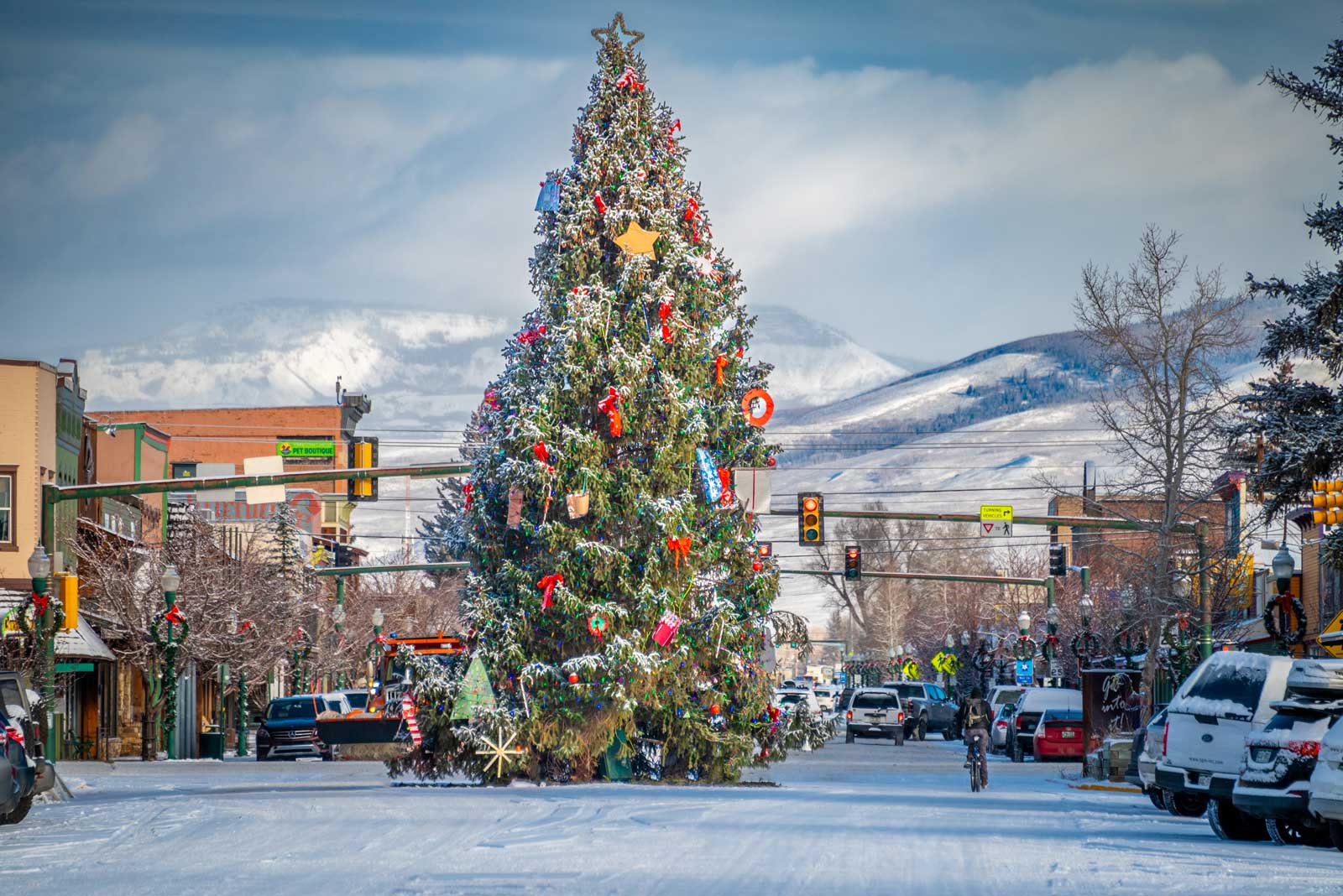 A two-story Chistmas tree sits in the middle of a snow covered street in Gunnison