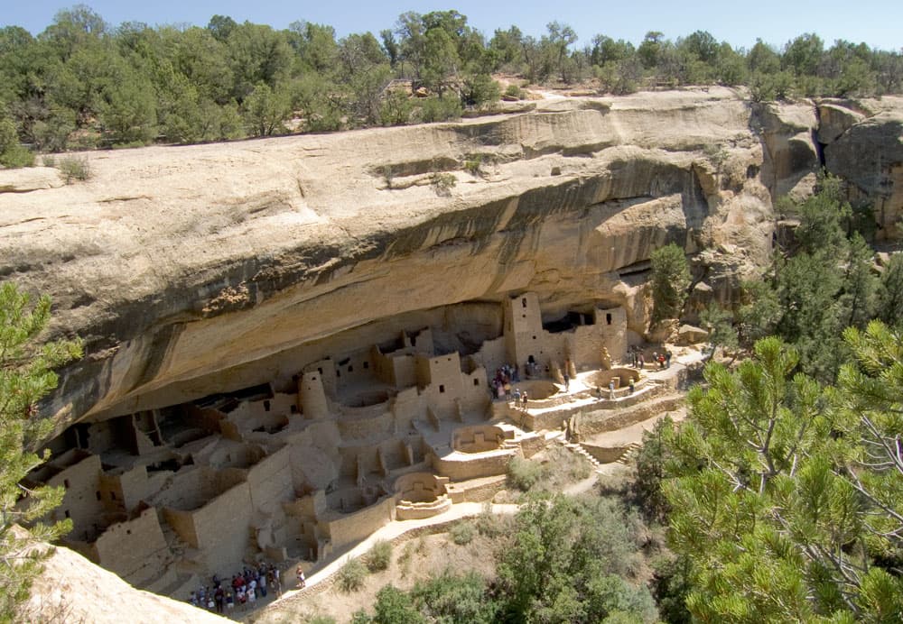 The sun shines down on some of the cliff dwellings inside Mesa Verde National Park near Cortez, Colorado.