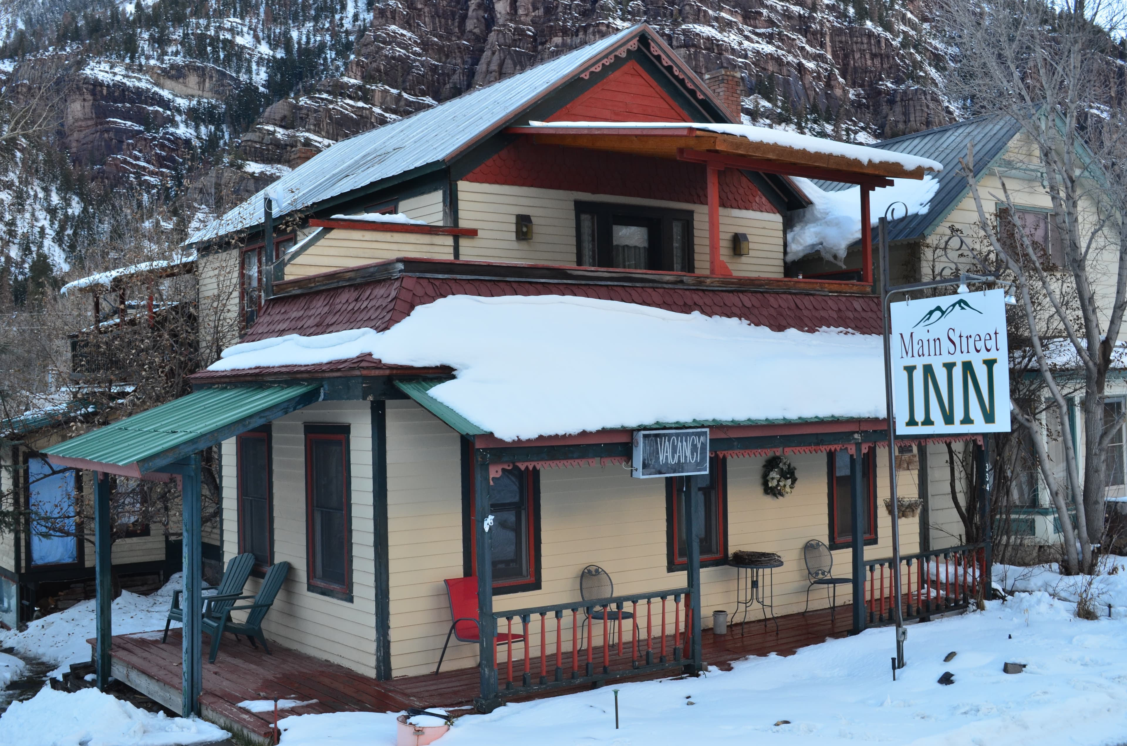 main street inn main house in snow photo