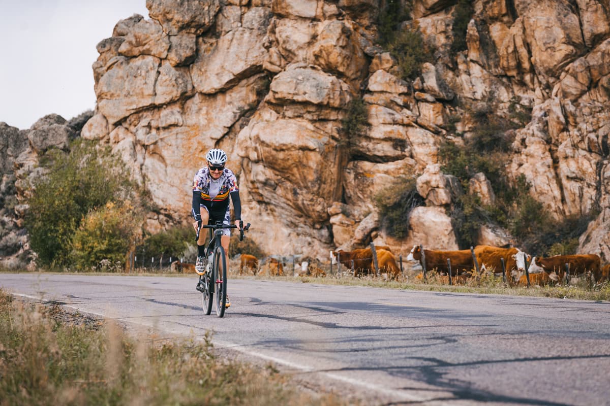 A cyclist rides down