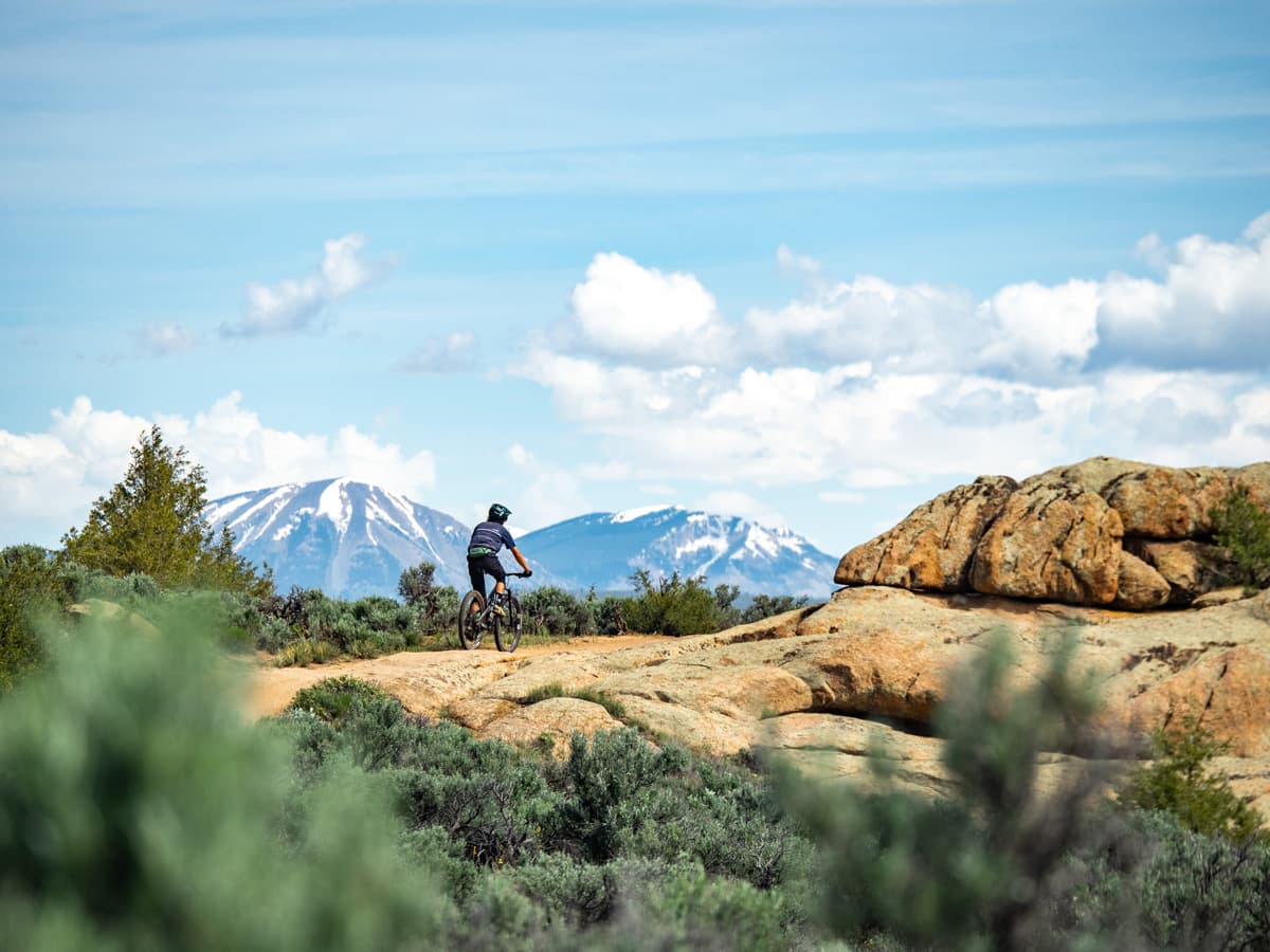 A person mountain biking at Hartman Rocks in Gunnison, Colorado