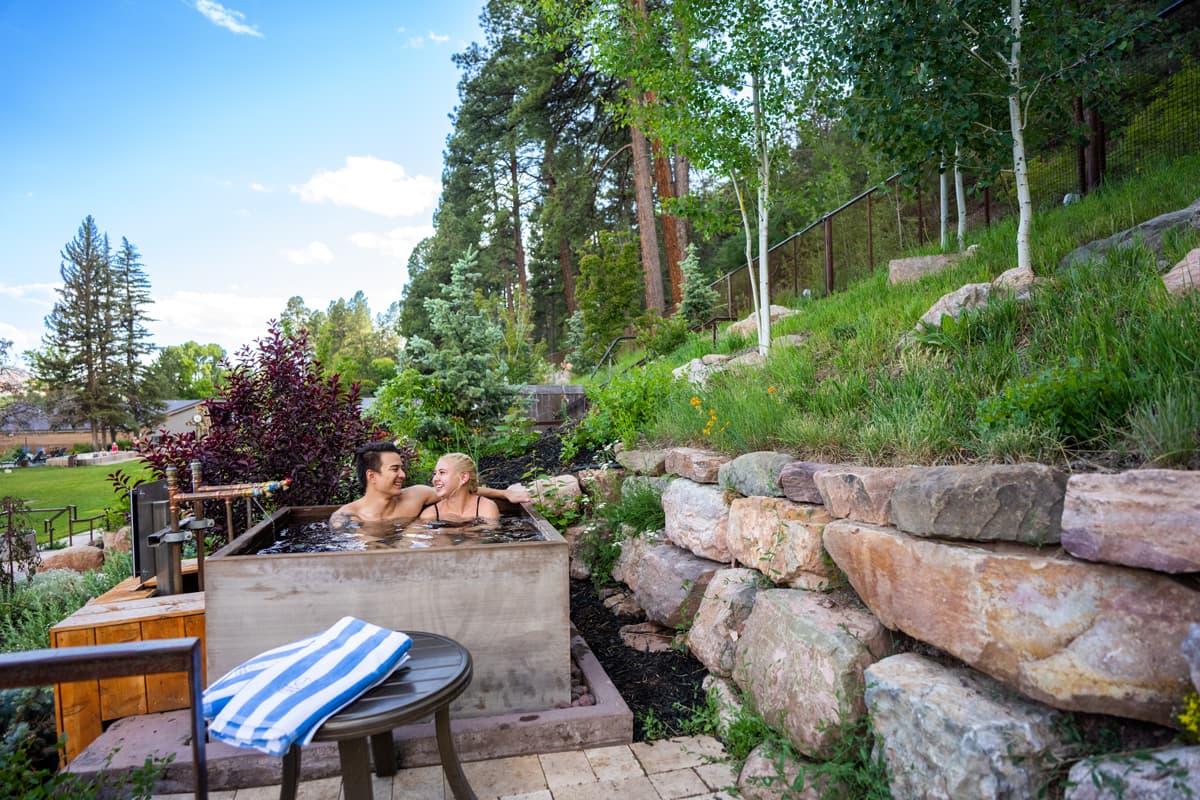 couple soaking in a hot-spring pool at Durango hot springs in colorado