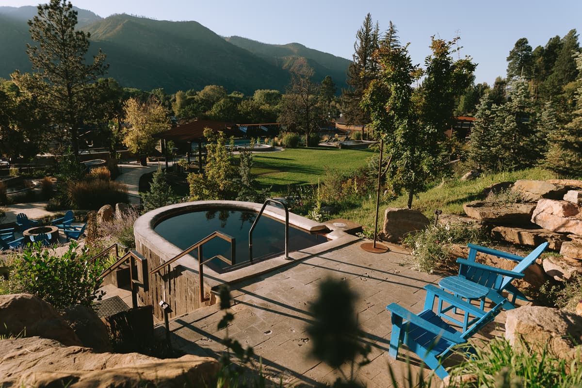 Views of the green-flocked mountains in summer from the pools of Durango Hot Springs in Coloraod