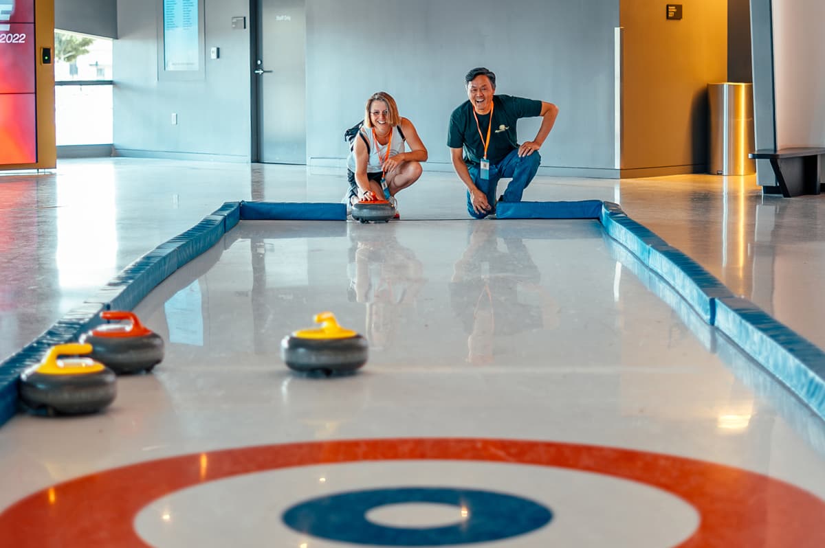Two people curling at the US Olympic & Paralympic Museum in Colorado Springs