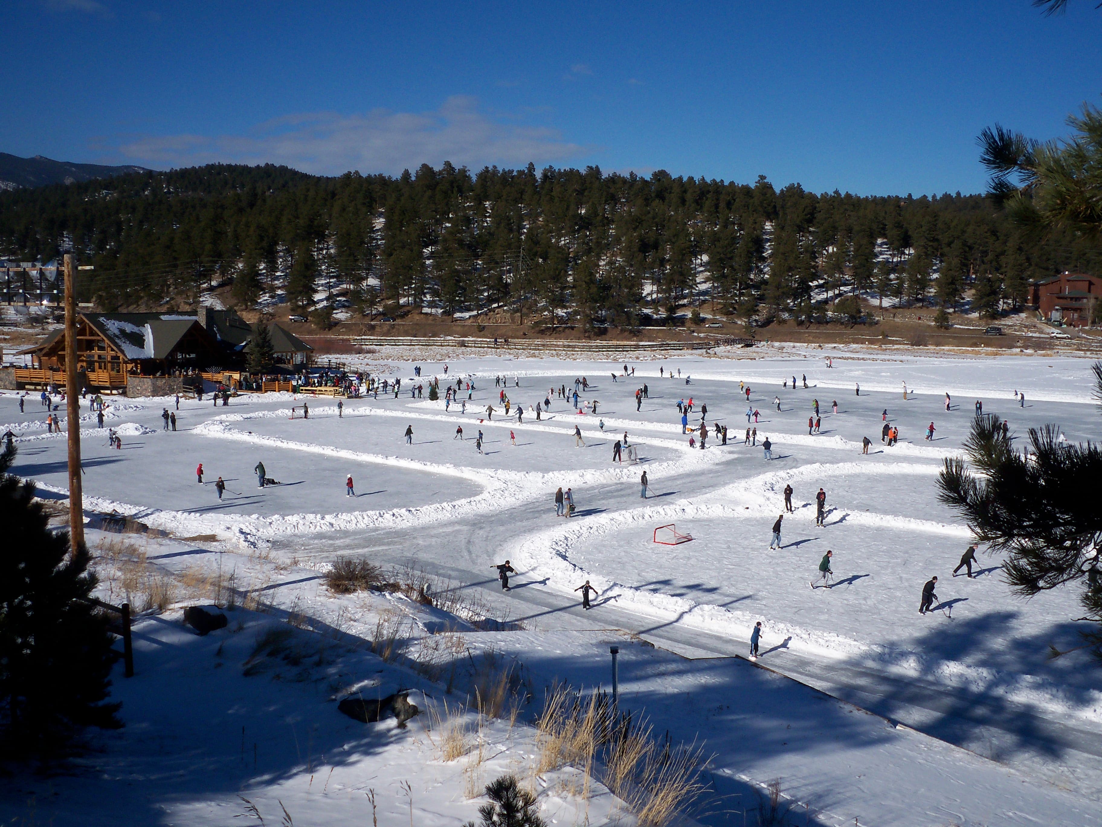 ice skating at evergreen lake on the world's largest groomed outdoor ice rink photo