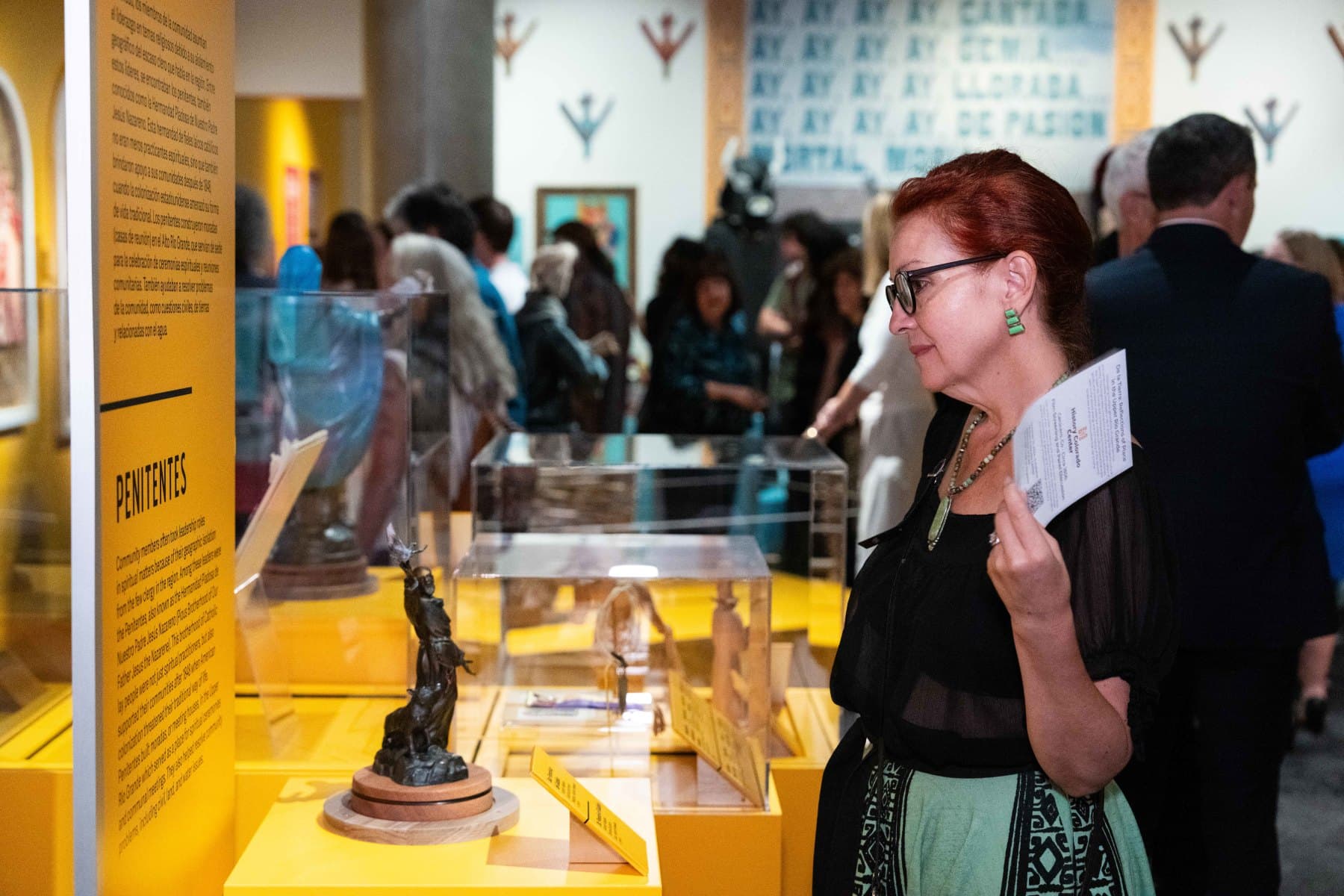 a patron observes the exhibition de la tierra photo 8