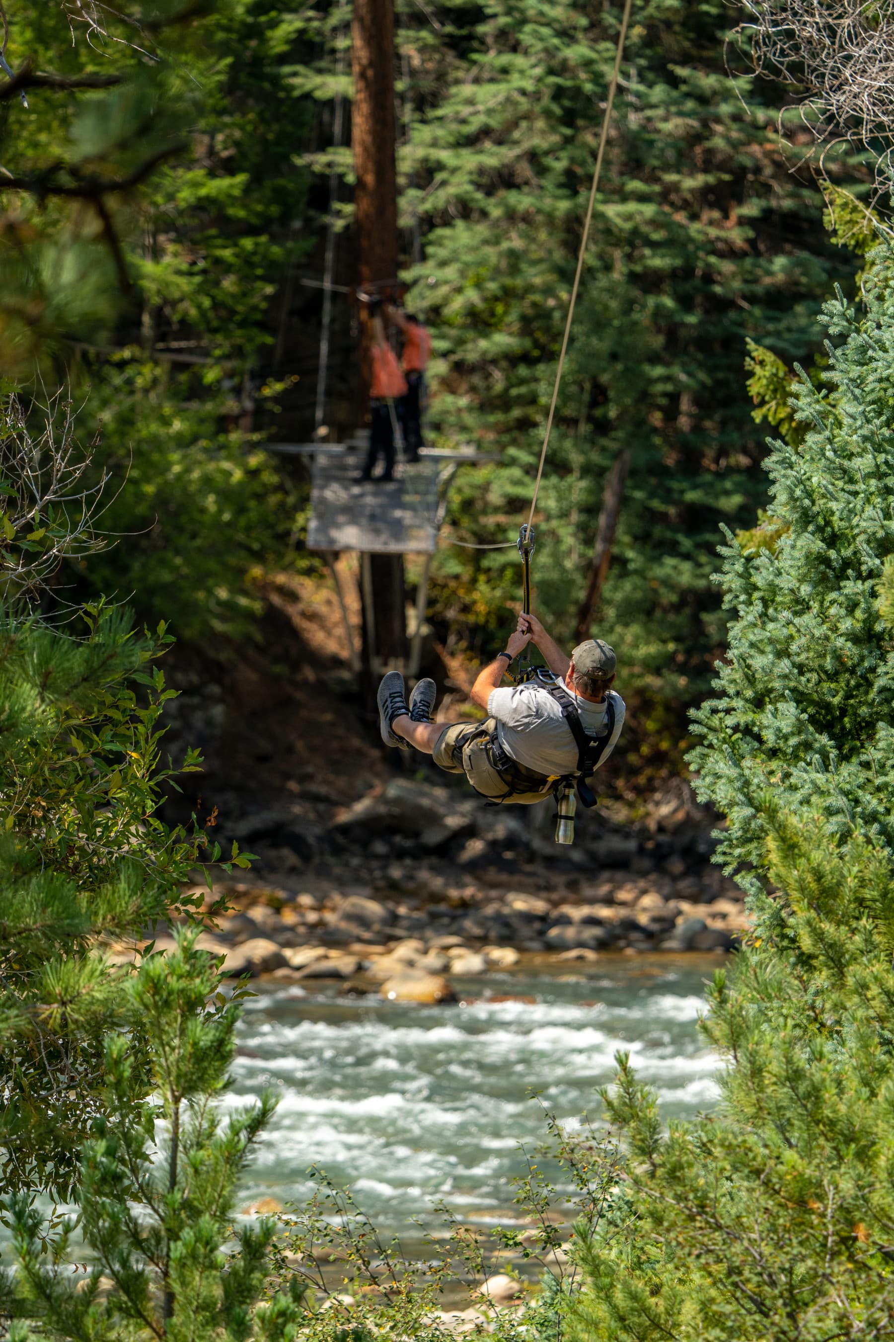 enjoying the cool mountain air ziplining across the river at soaring photo 19