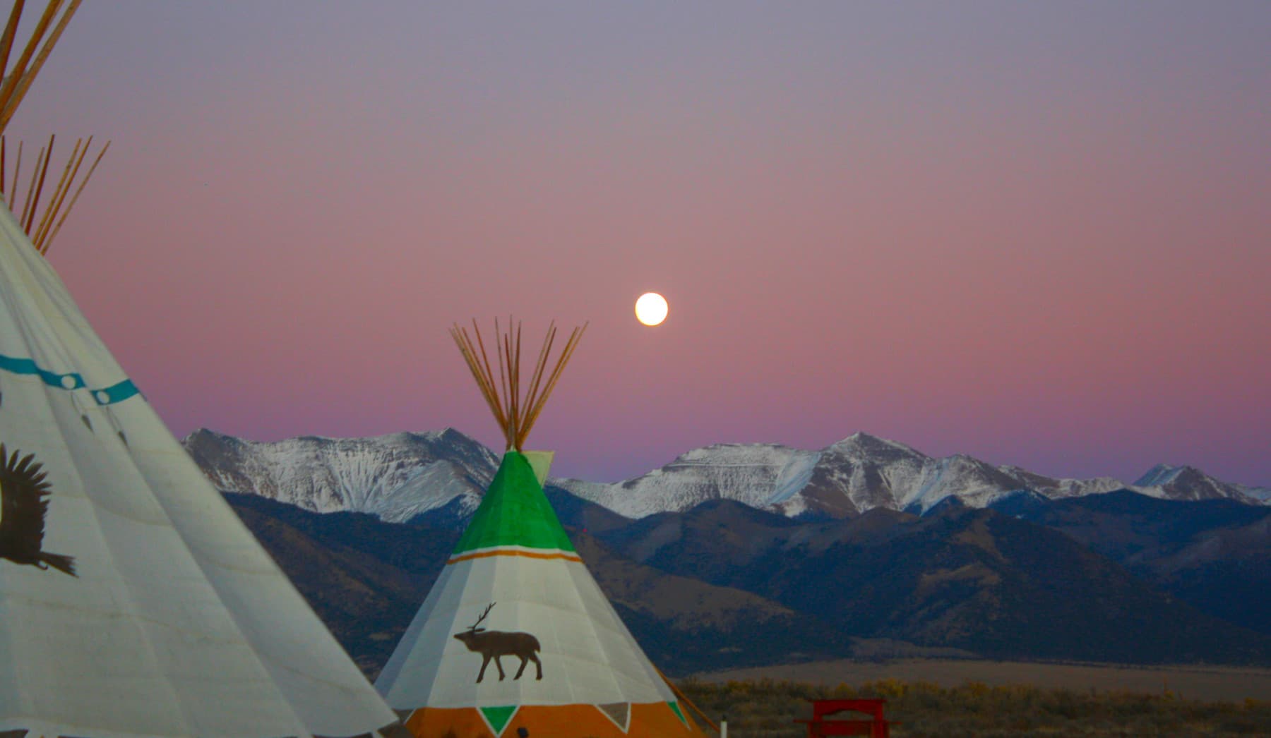 the tipis and a full moon photo