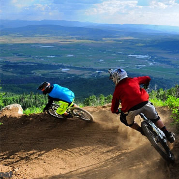 Instagram Two mountain bikers on a dirt trail.