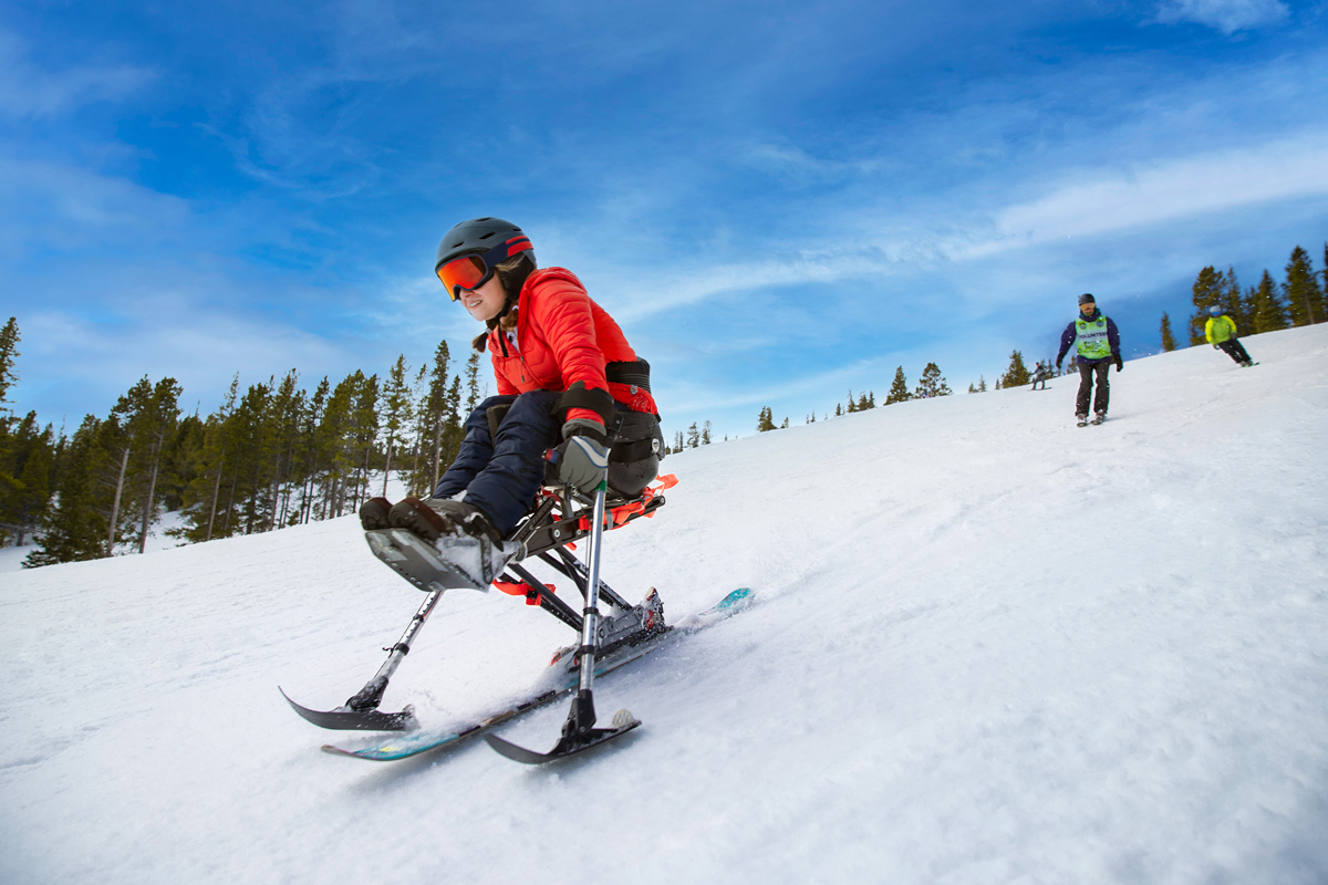 Skier with disabilities on adaptive skis in Winter Park, Colorado