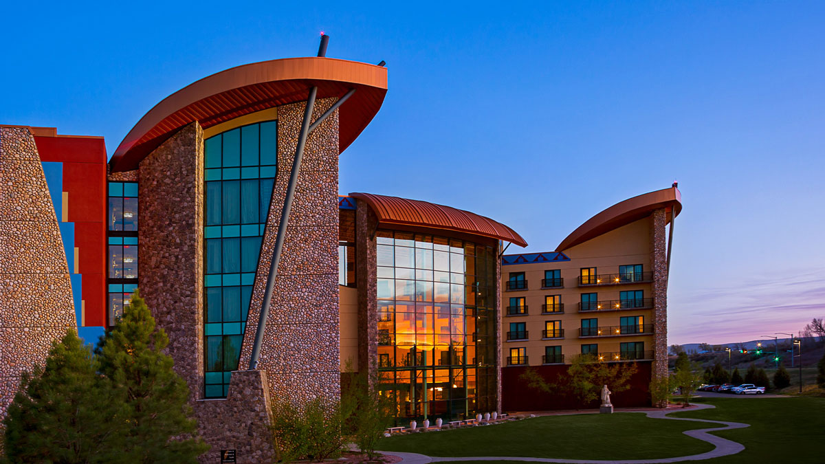Exterior view of a casino with a blue sky behind it