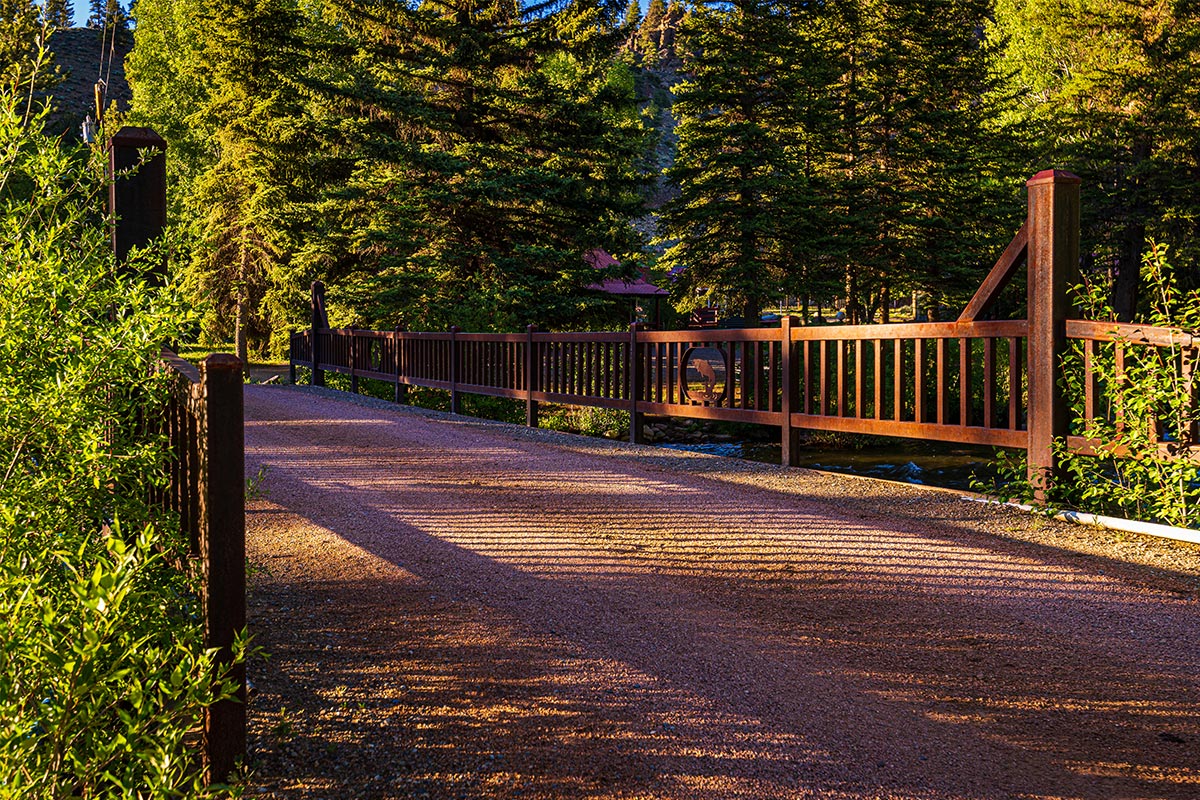 A bridge allows adventurers and vehicles to pass through. The bridge has a decorative fish design in the middle of the railing.