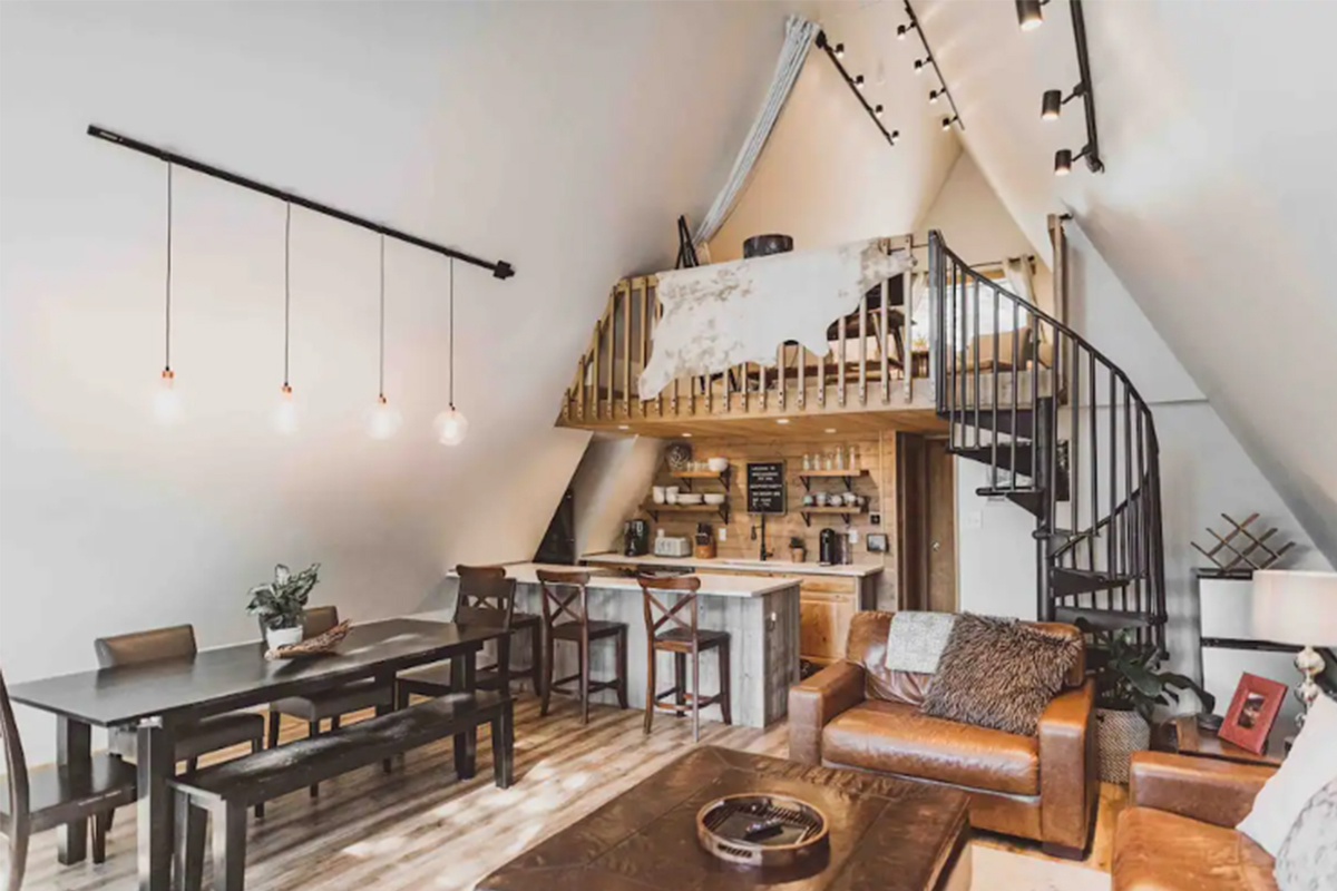 High Point Hideaway offers plenty of space to gather and hang out with your group, including plush, brown leather couches, bar seats, a dark wooden bench or chairs around the table.