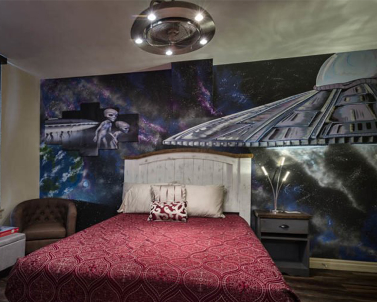 In this Area-51-themed guest room at Ore House Inn in New Castle, big-headed aliens and massive flying space ships decorate the walls.