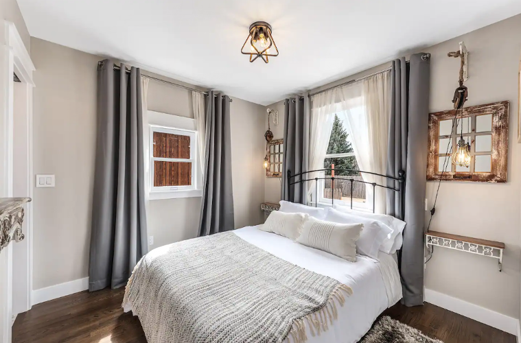 Aggie House in Louisville features cozy bedrooms in shades of white and gray