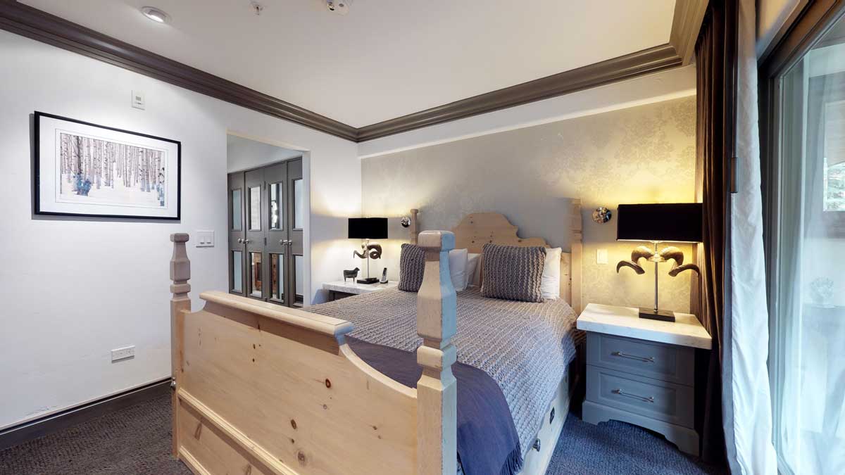 Interior view of a bedroom in a condo at Christiania at Vail