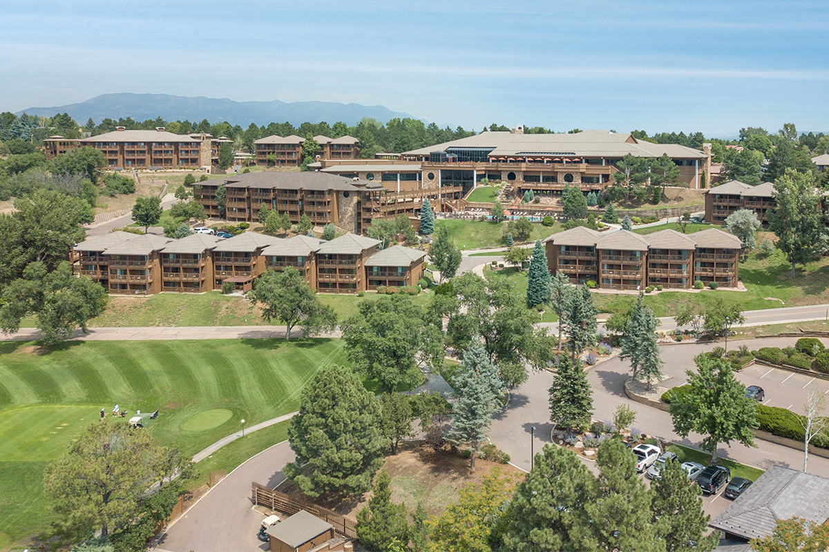Cheyenne Mountain Resort near Colorado Springs, Colorado, spreads out across a rolling landscape peppered with mature trees.