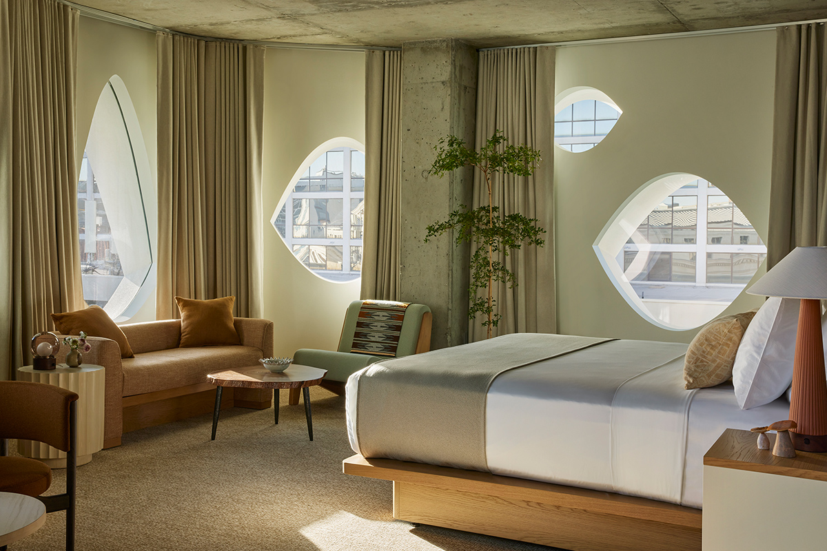 Earthy tones, minimalist vibes and aspen-inspired windows greet guests of the Mountain Studio Suite at the Populus hotel in Denver, Colorado.