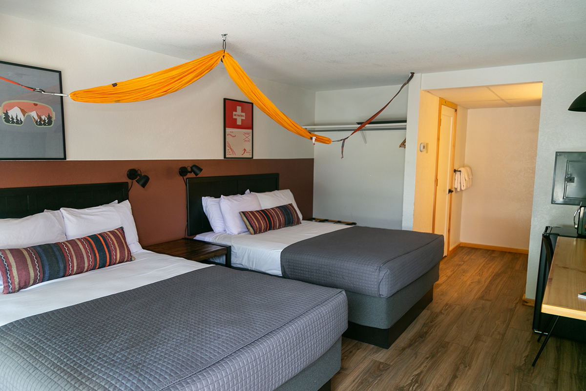 A hammock is strung up across a guest room at the LOGE Wolf Creek near South Fork, Colorado.