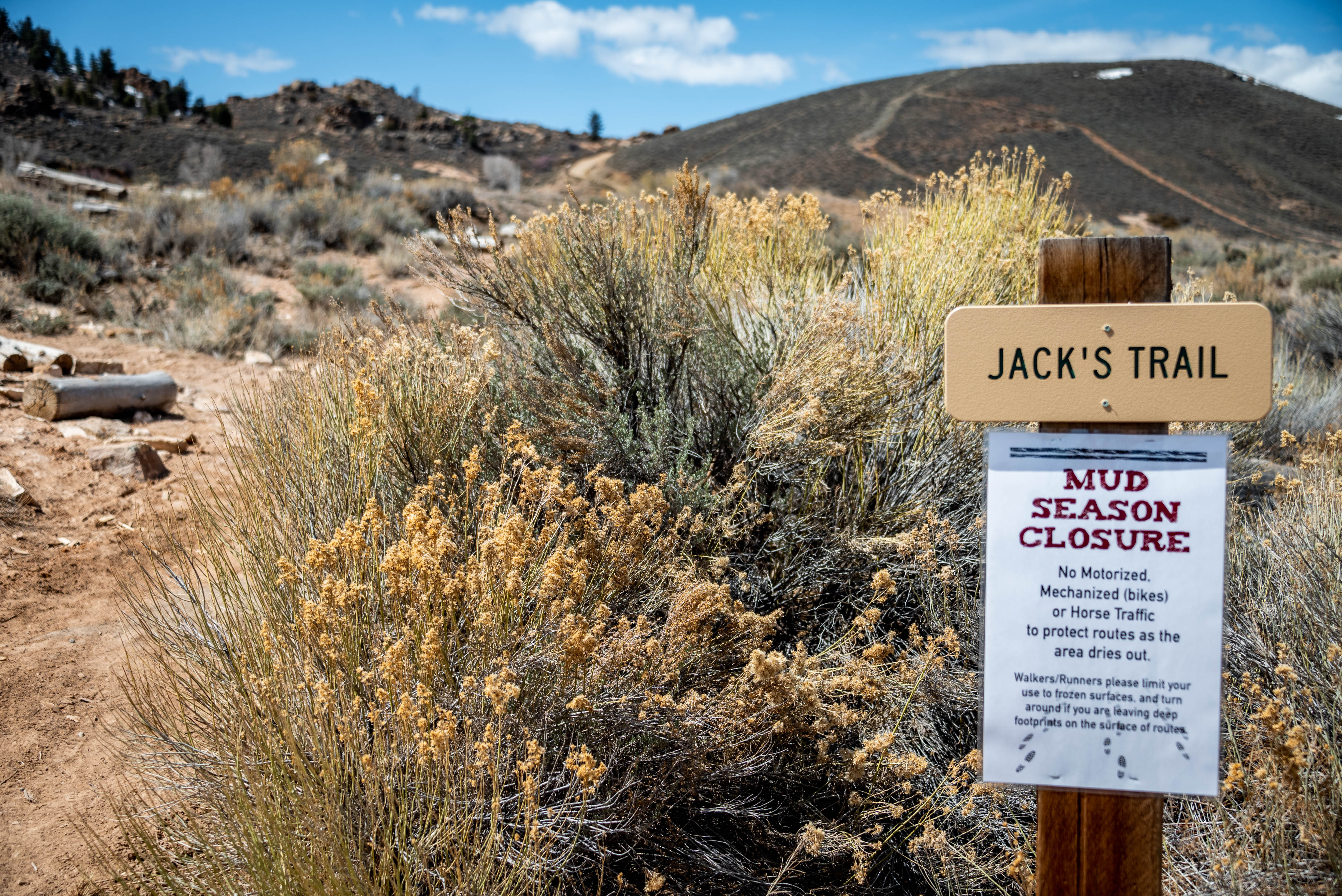 A sign denoting closure for mud season on a trail in Gunnison, Colorado. 