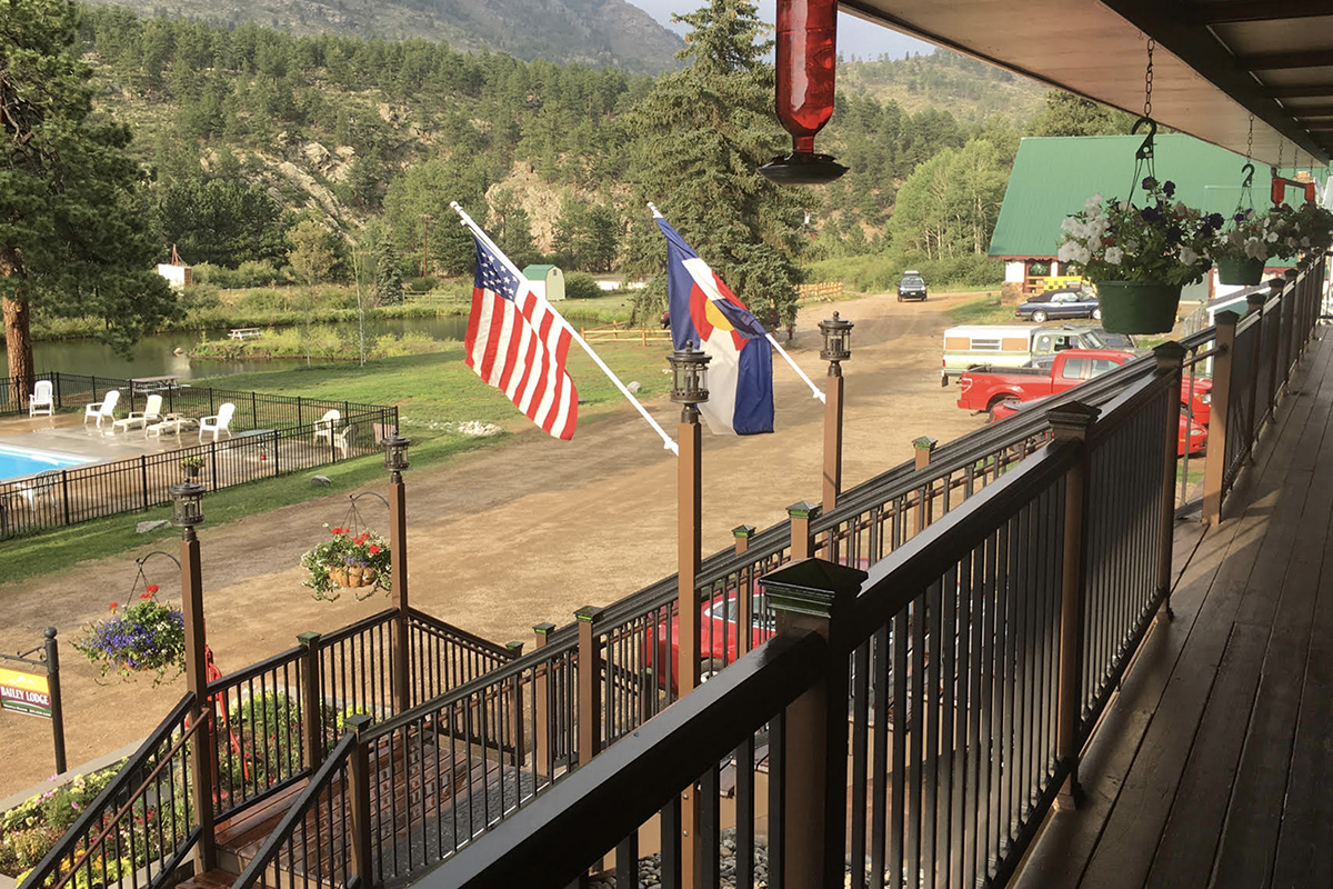 From the porch of the Bailey Lodge in Bailey, Colorado, you can see the charming pond, a cool pool and stunning mountain views.