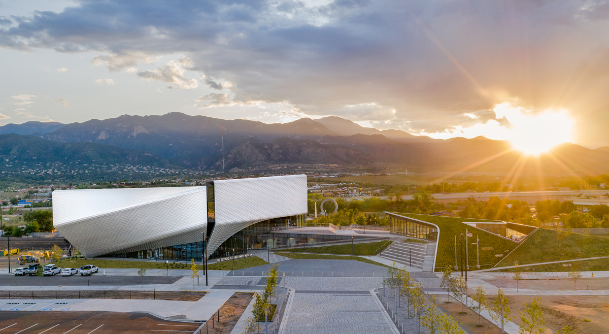 Exterior shot of U.S. Olympic & Paralympic Museum in Colorado Springs with the sun going down behind the mountains
