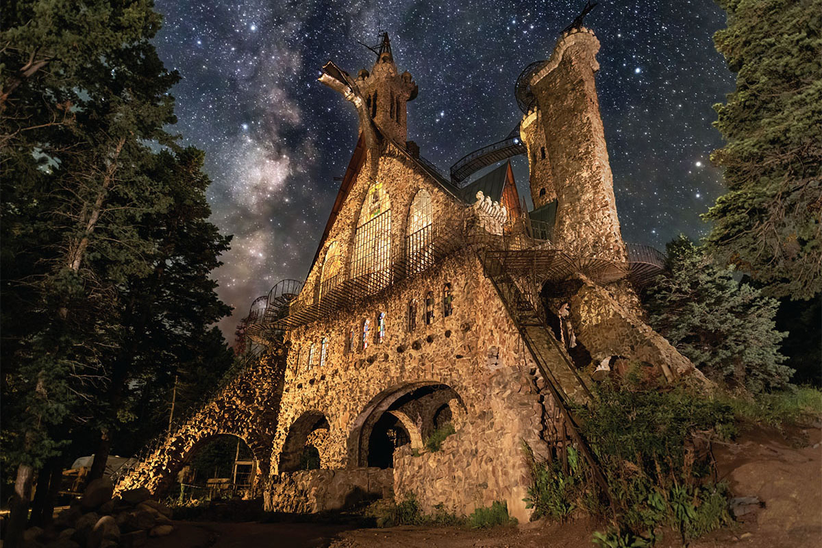 Looking up at the top of Bishop's Castle at night with the Milky Way floating above in Westcliffe, Colorodo. 