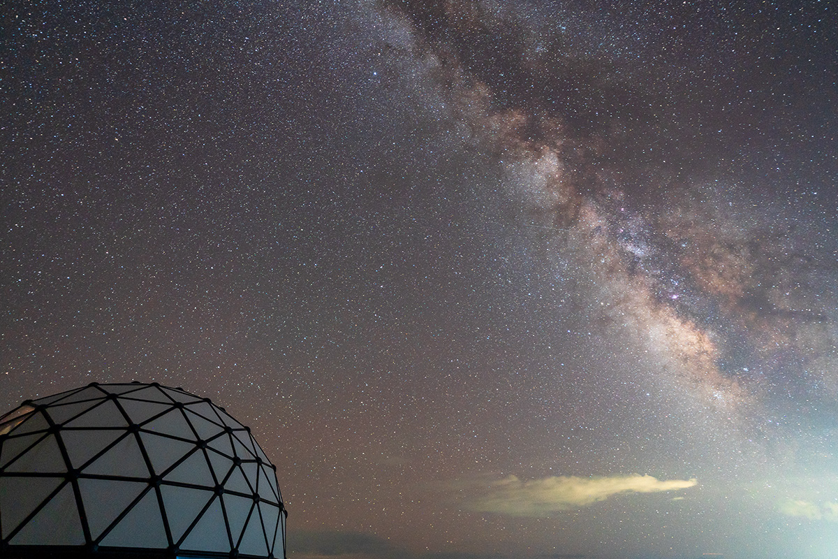 One of the domes at Kosmos' stands with a vast star- and Milk Way-filled Colorado night sky in the background.