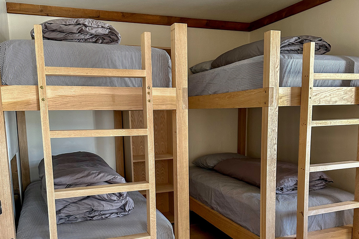 Simple, but sturdy bunks at OPUS Hut are perfect for sharing resting between your alpine adventures with friends.