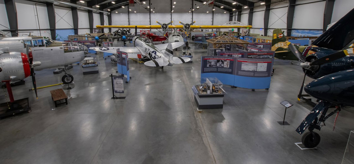 Vintage aircraft and exhibits inside the National Museum of World War II Aviation in Colorado Springs.