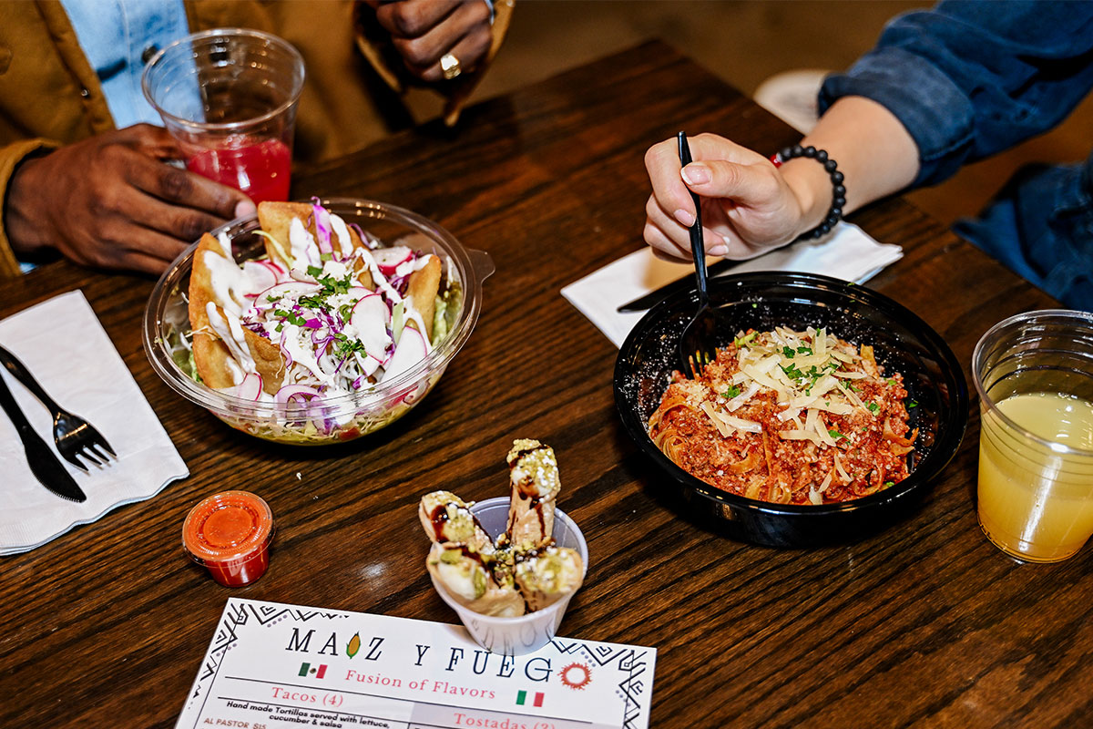 A table filled with Mexican dishes drinks at a restaurant in Aurora, Colorado